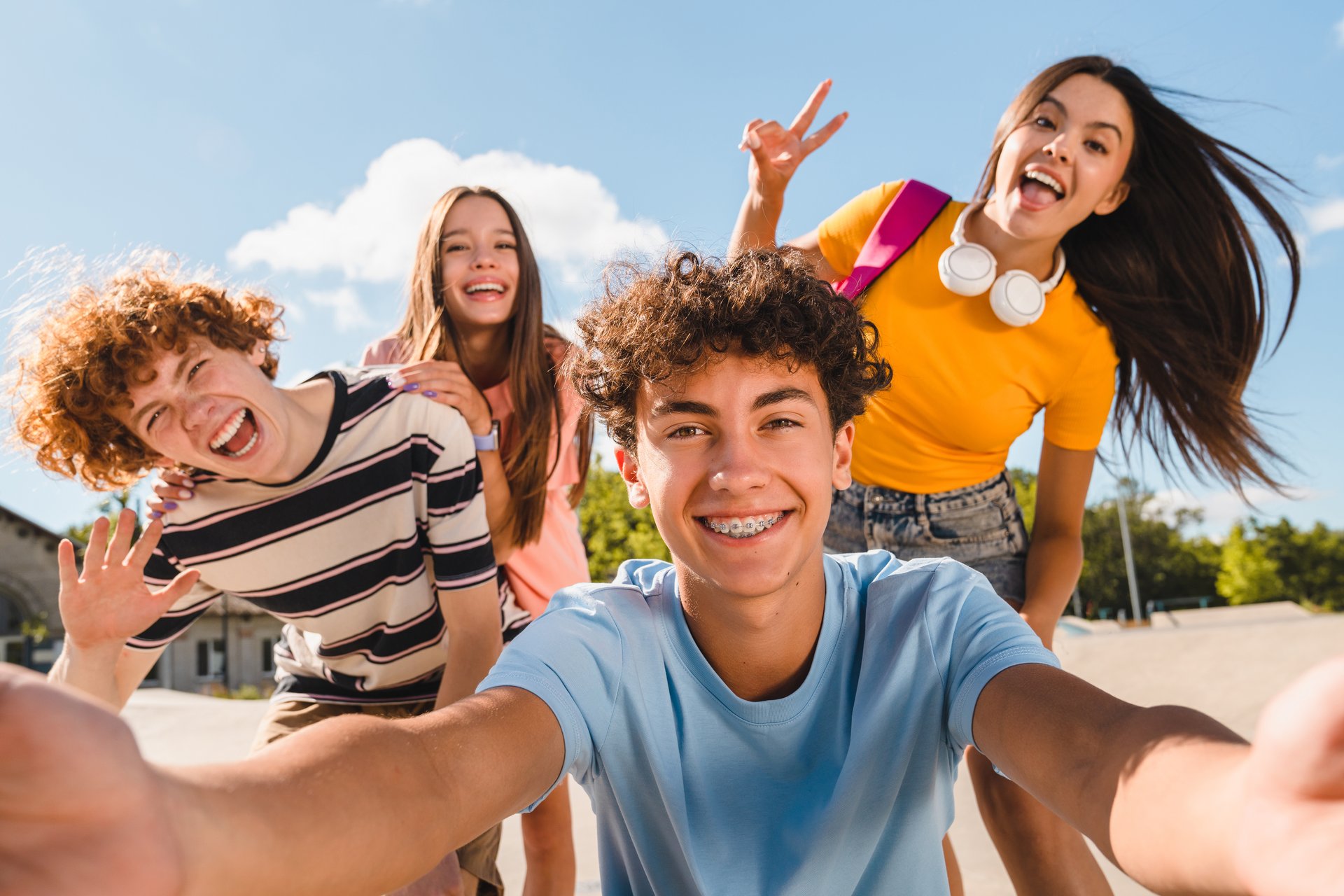 Selfie shot of crazy young people friends college students having fun